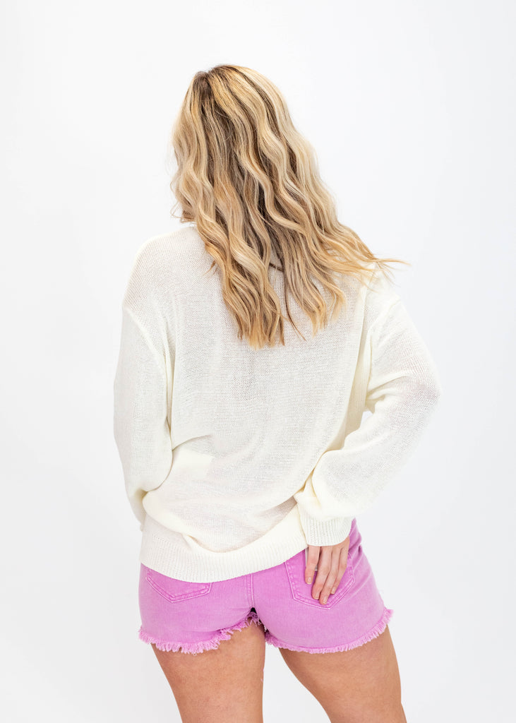 lightweight white sweater with phrase "sunny days club"