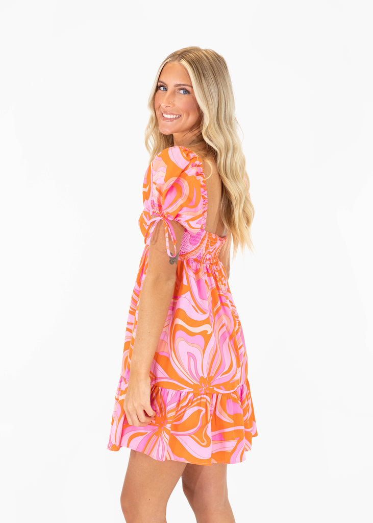 pink and orange printed dress with puff sleeves