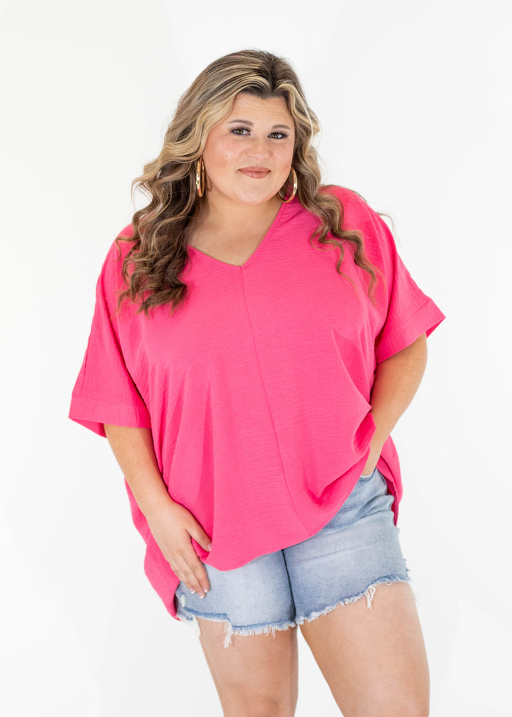 hot pink v-neck top with short sleeves