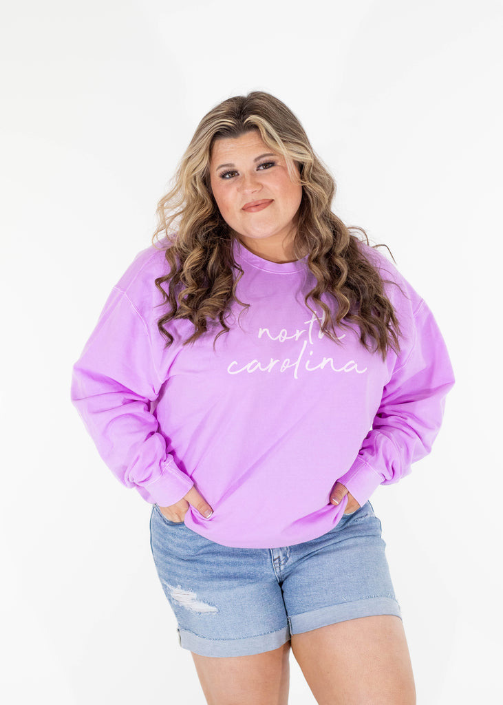 purple sweatshirt with white "north carolina" print