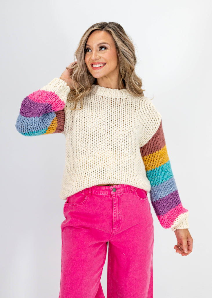 cream knit sweater with multicolor sleeves